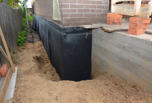 SJ Waterproofing Pros technician performing targeted Waterproofing assessment in Santa Fe, TN